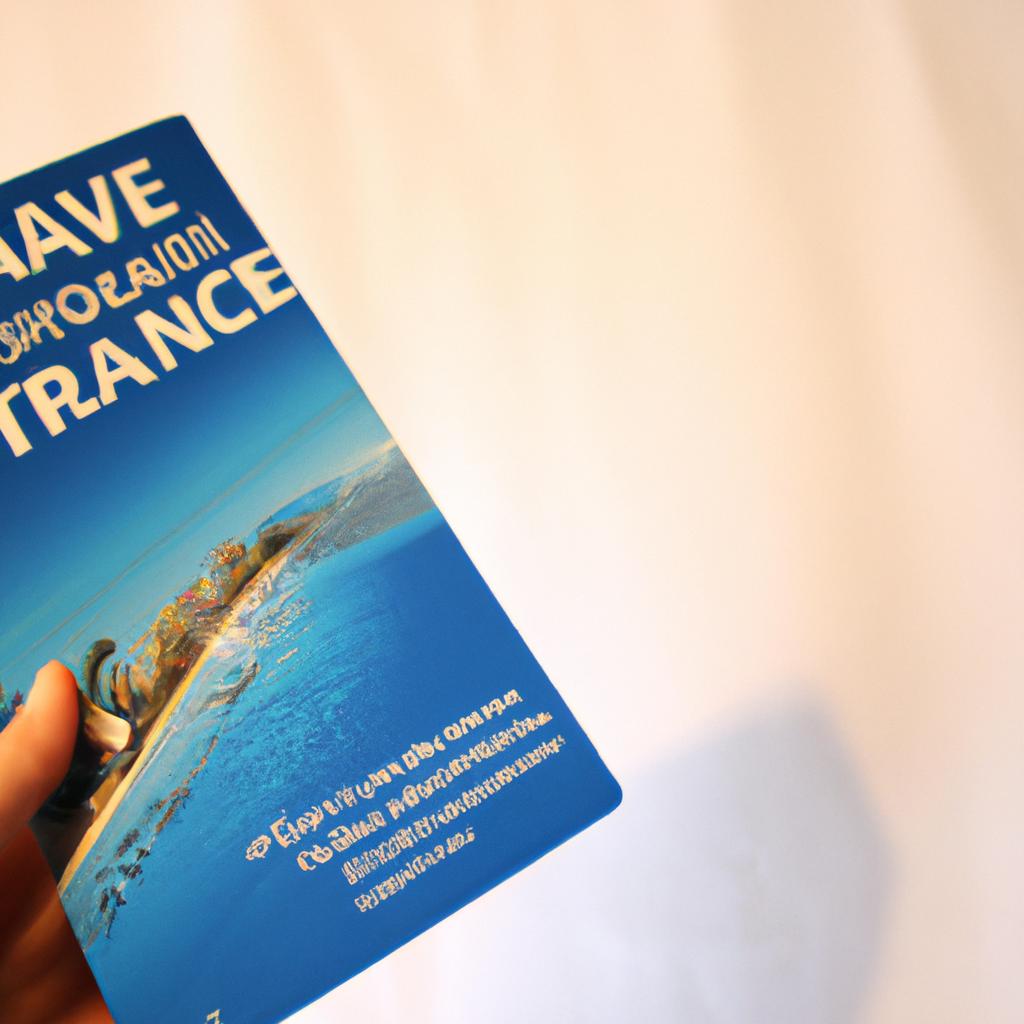 Person holding travel insurance brochure